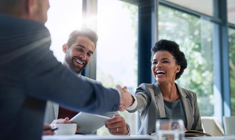 Hiring leaders finalizing a successful recruitment decision during a professional meeting